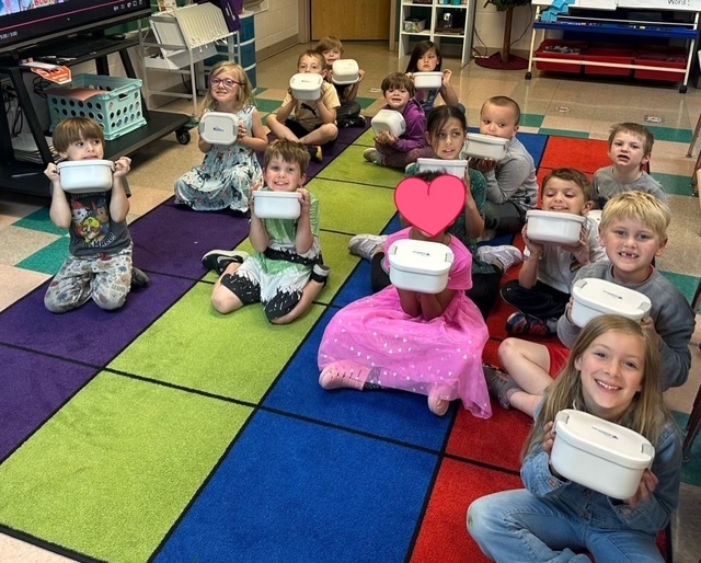 kindergarten holding take-homes