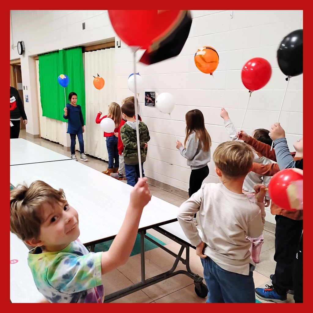 MAKERS: Student participates in balloon display for art project.