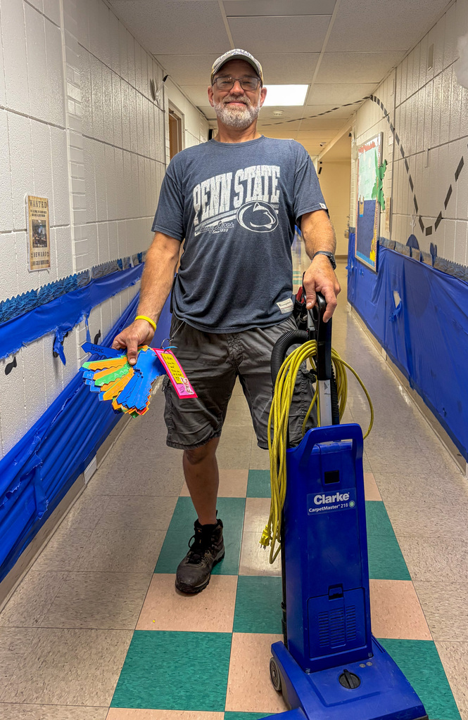 Mr. Wilson with Vacuum Cleaner