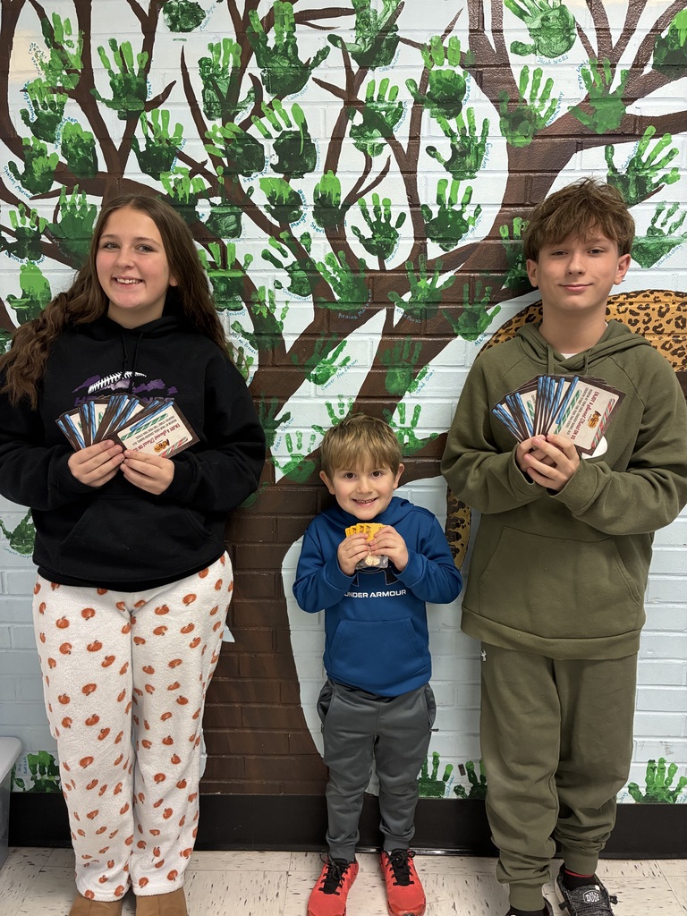 Students showing off Cracker Barrel vouchers