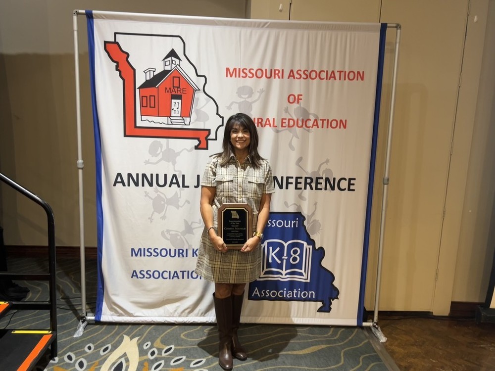 Dr. Mayfield with her award