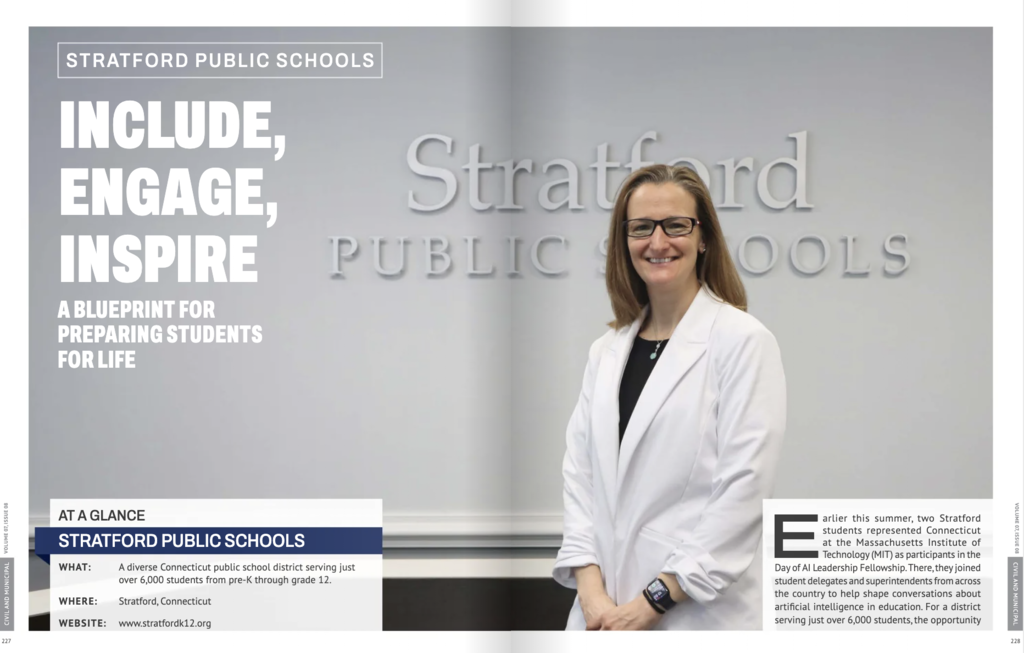 A woman smiling in front of a Stratford Public Schools wall logo on a magazine spread titled "Include, Engage, Inspire: A Blueprint for Preparing Students for Life."