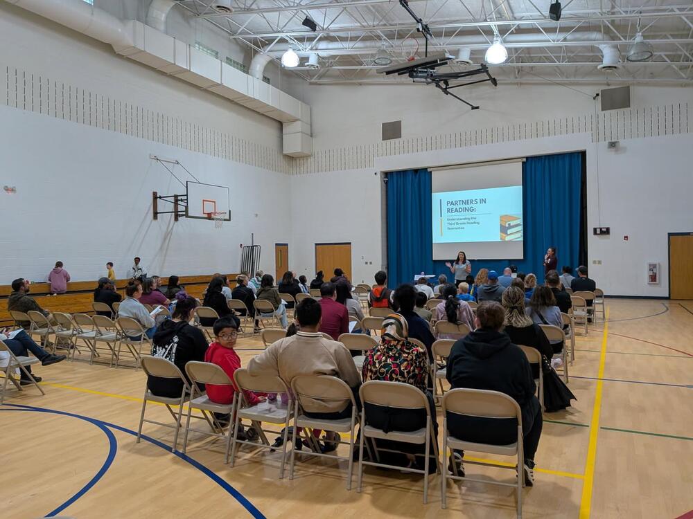 parents listening at a meeting