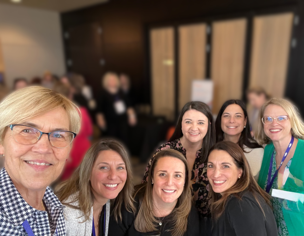 Teachers smiling for womens history month