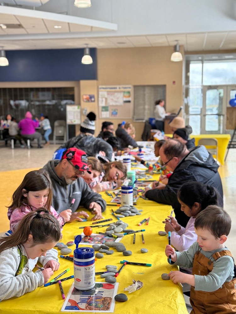 Families gather for rock painting during Streetsboro City Schools' fourth annual Wellness Fair on January 31 at Streetsboro High School.