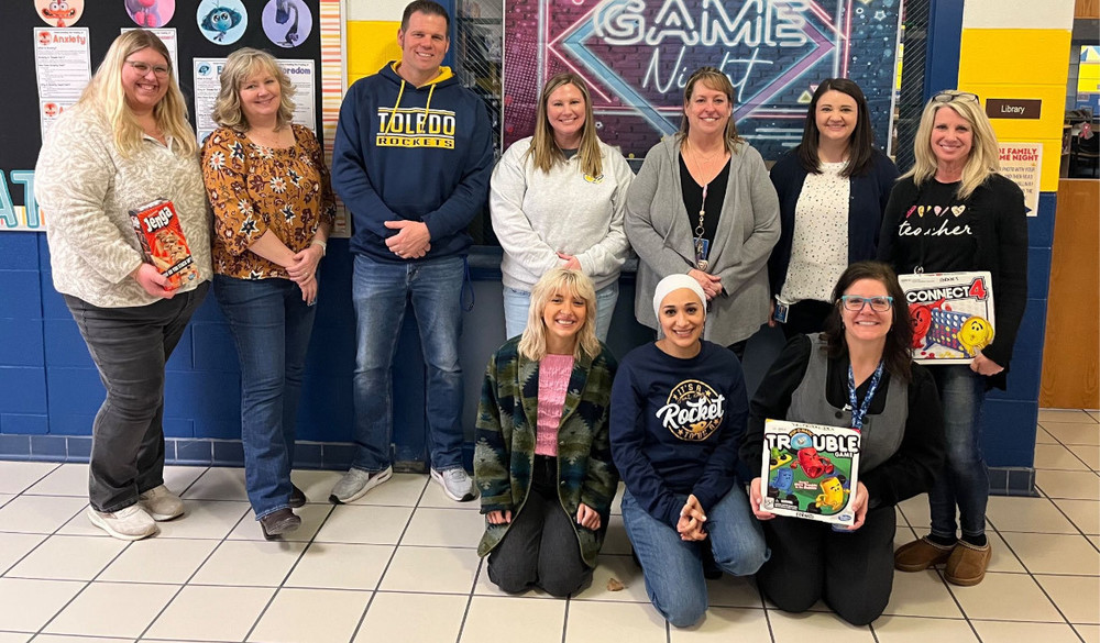 Teachers smiling at game night