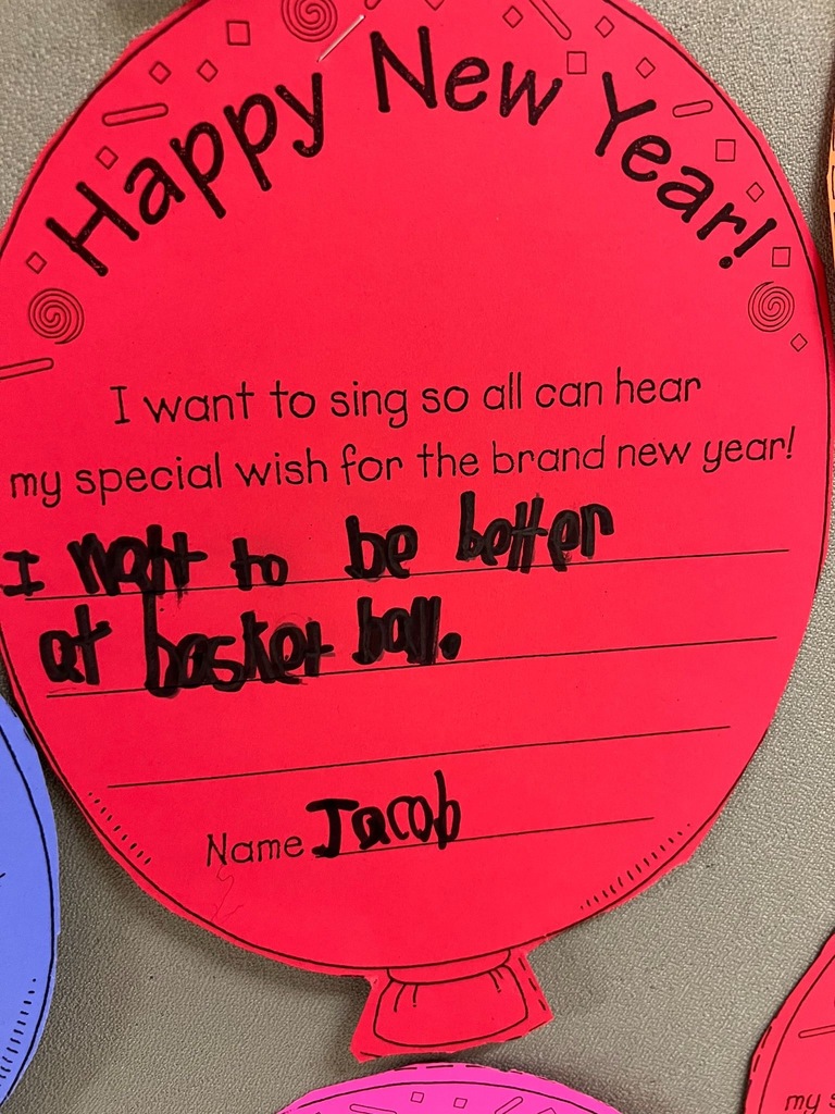 Pictures of balloons in different colors that say "happy new year: I want to sing so all can hear my special wish for the brand new year." and then student filled responses. 