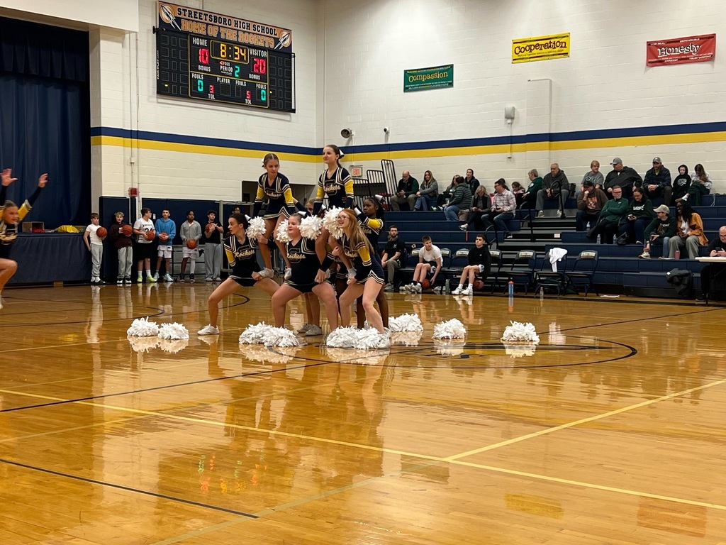 Cheerleaders on basketball court.