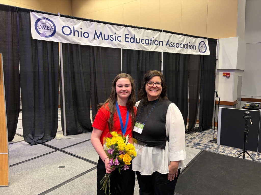 Mrs. BethAnn Hepburn and Joey. Banner is the back says: Ohio Music Education Association 