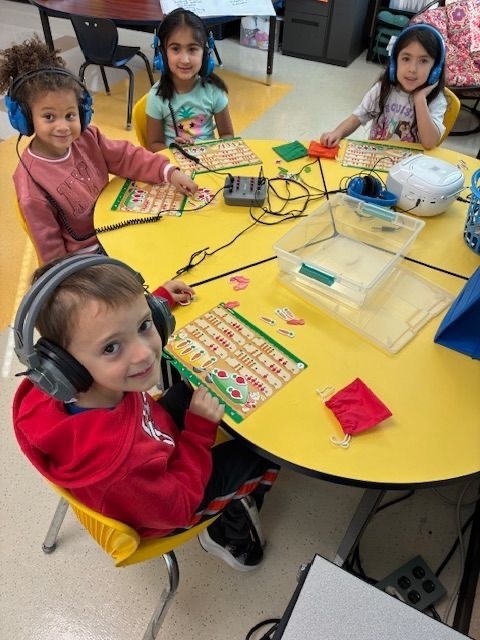 Kindergarten students love Math Workplaces! They enjoy participating in hands-on activities to make mathematics come alive. Our young Rockets count, sort, compare, add and subtract to build early math skills.  The students are also creating graphs to compare data!   