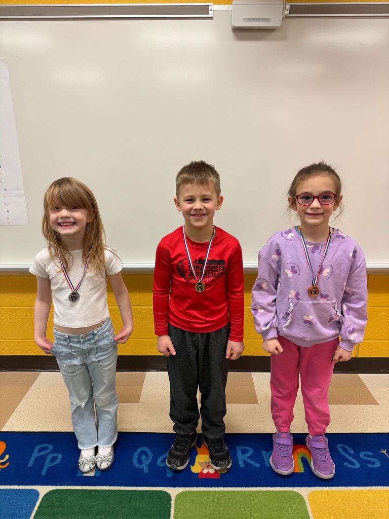 Students playing olympics games in a classroom. 