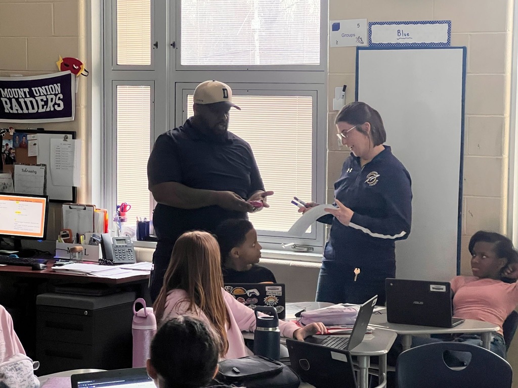 Mrs. Spence holding her award. 
