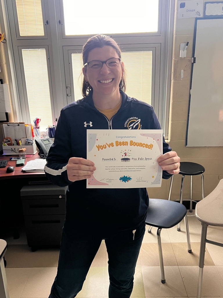 Mrs. Spence holding her award. 