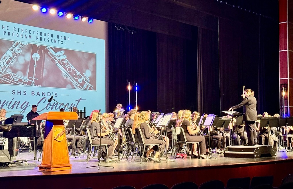 Streetsboro band is on stage playing their instruments 