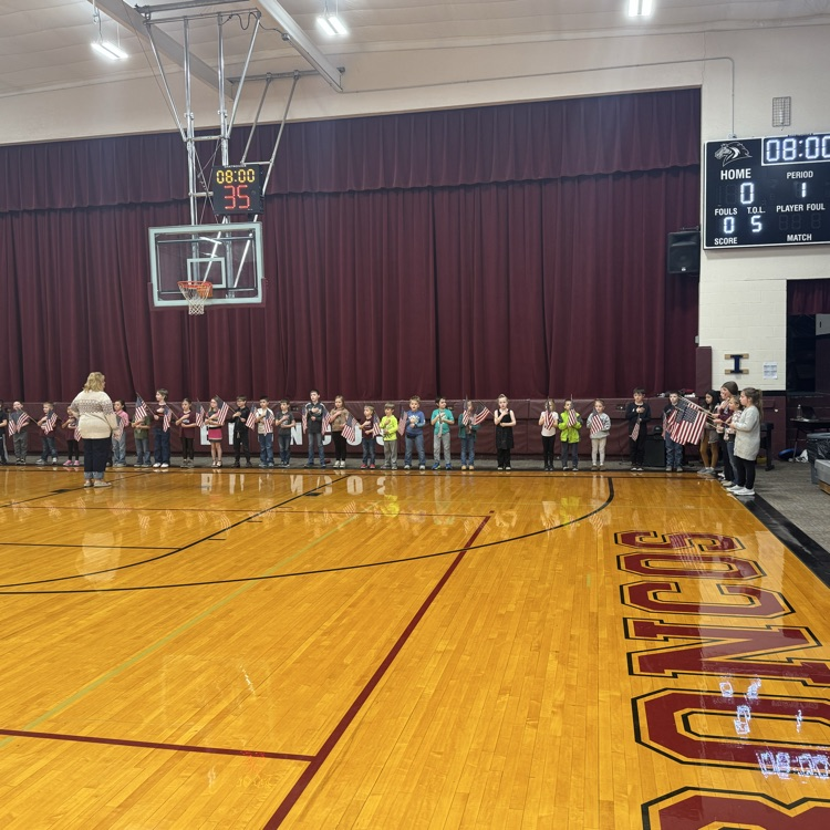 K-4 sing the anthem.