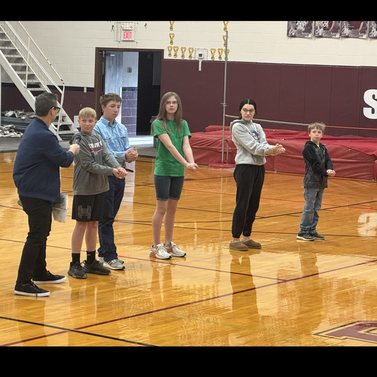 Students take part in a magic trick.