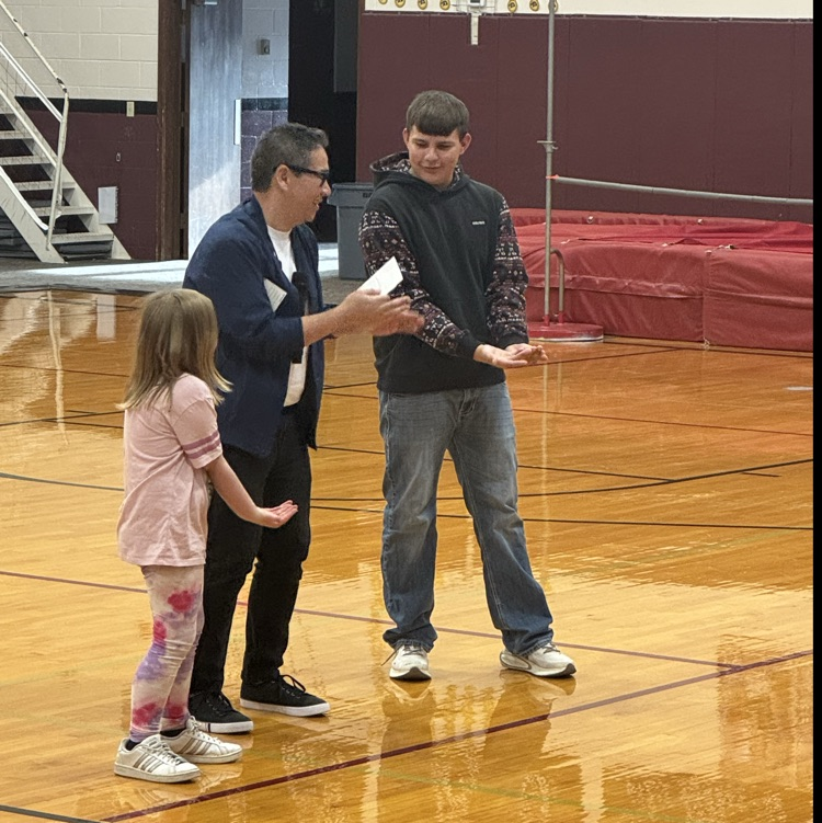 Gus and Temperance participate in a magic act  
