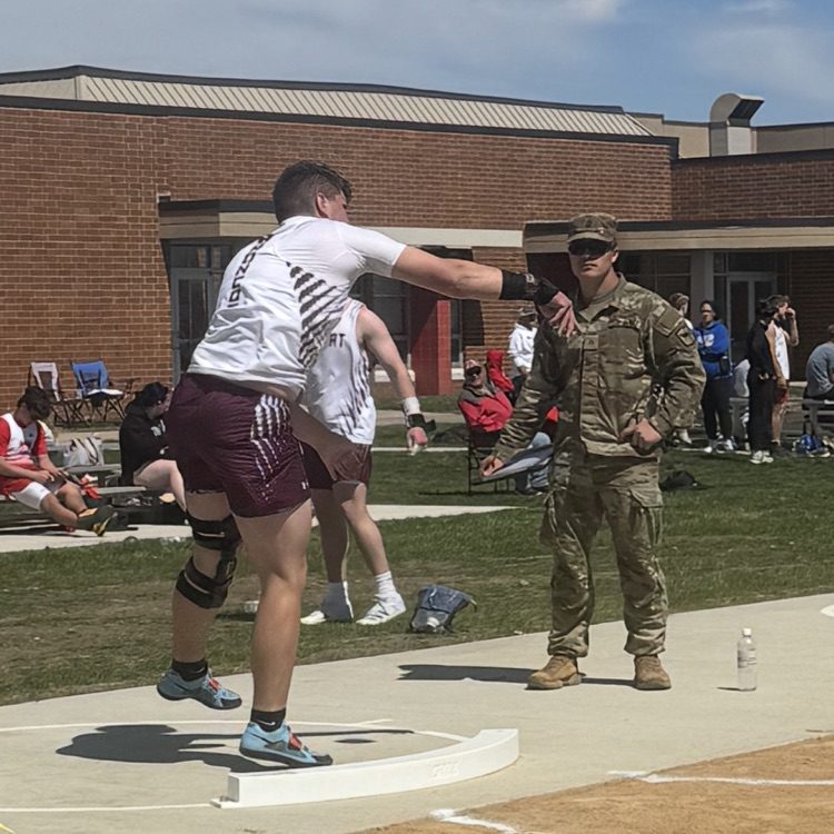 Zane throws shot put.
