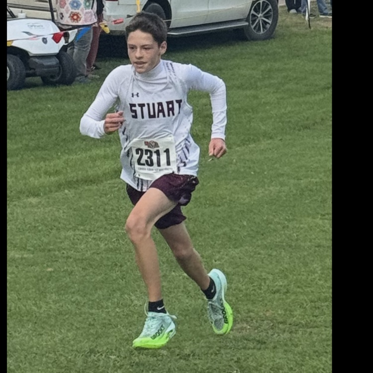 Cayden runs to the finish with a time of 20:19.