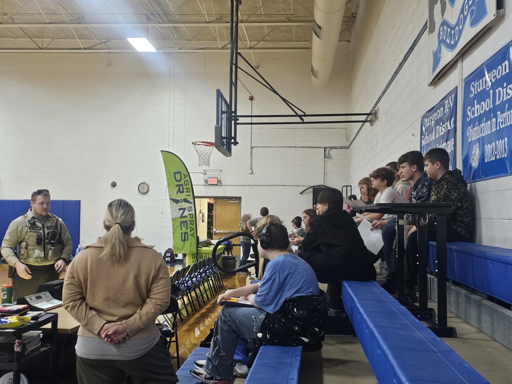 Students listening to a speaker at the career fair.