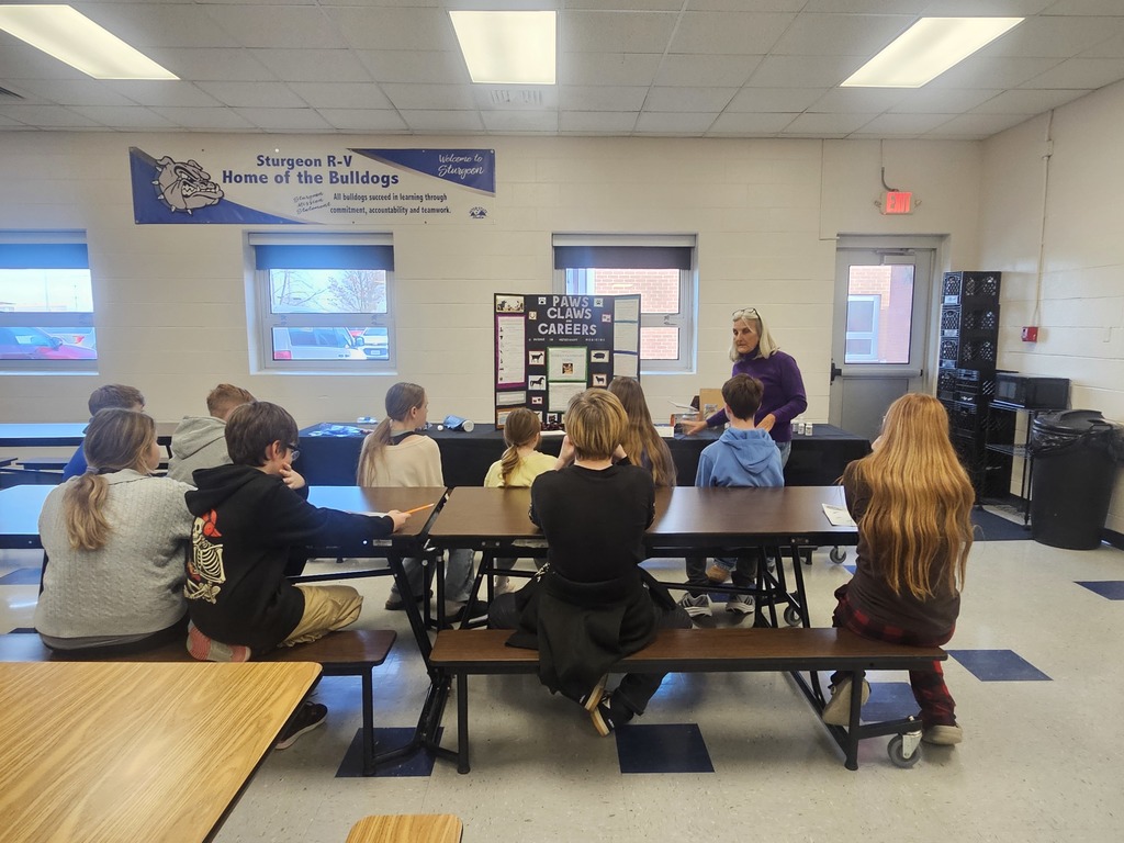 Students listening to a speaker at the career fair.