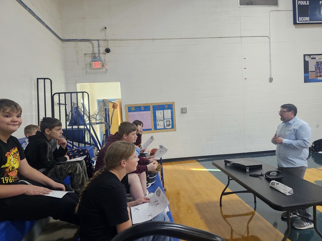 Students listening to a speaker at the career fair.