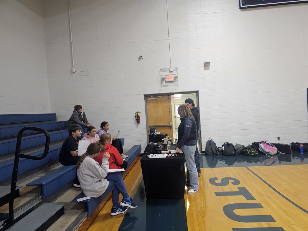 Students listening to a speaker at the career fair.