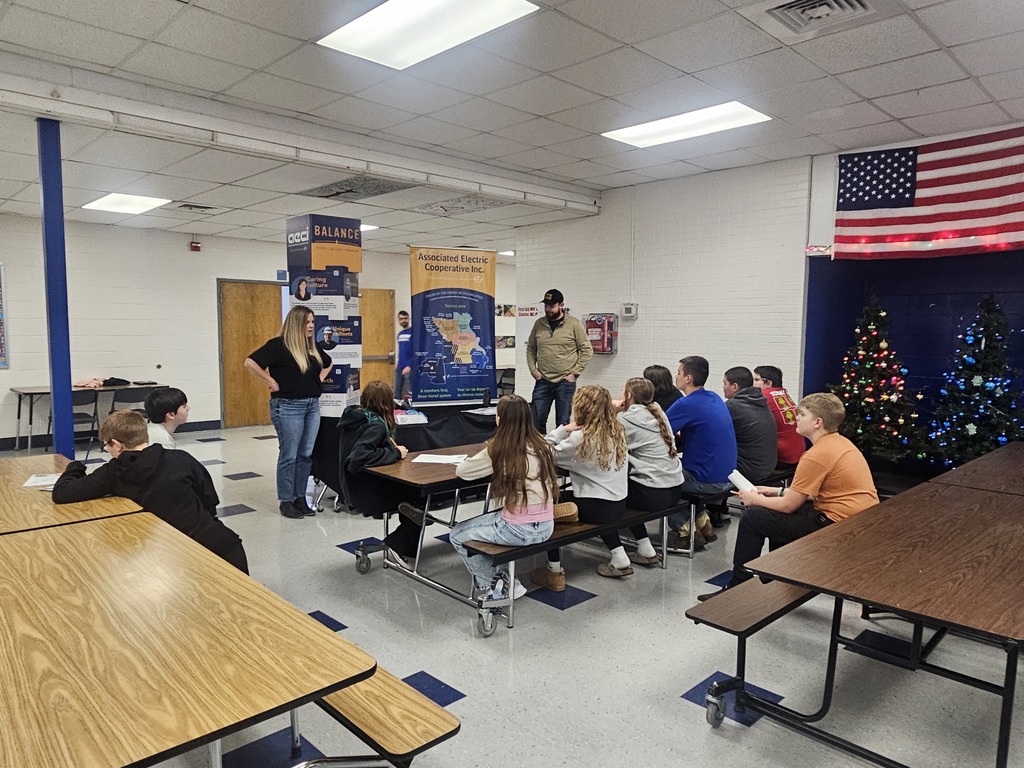 Students listening to a speaker at the career fair.