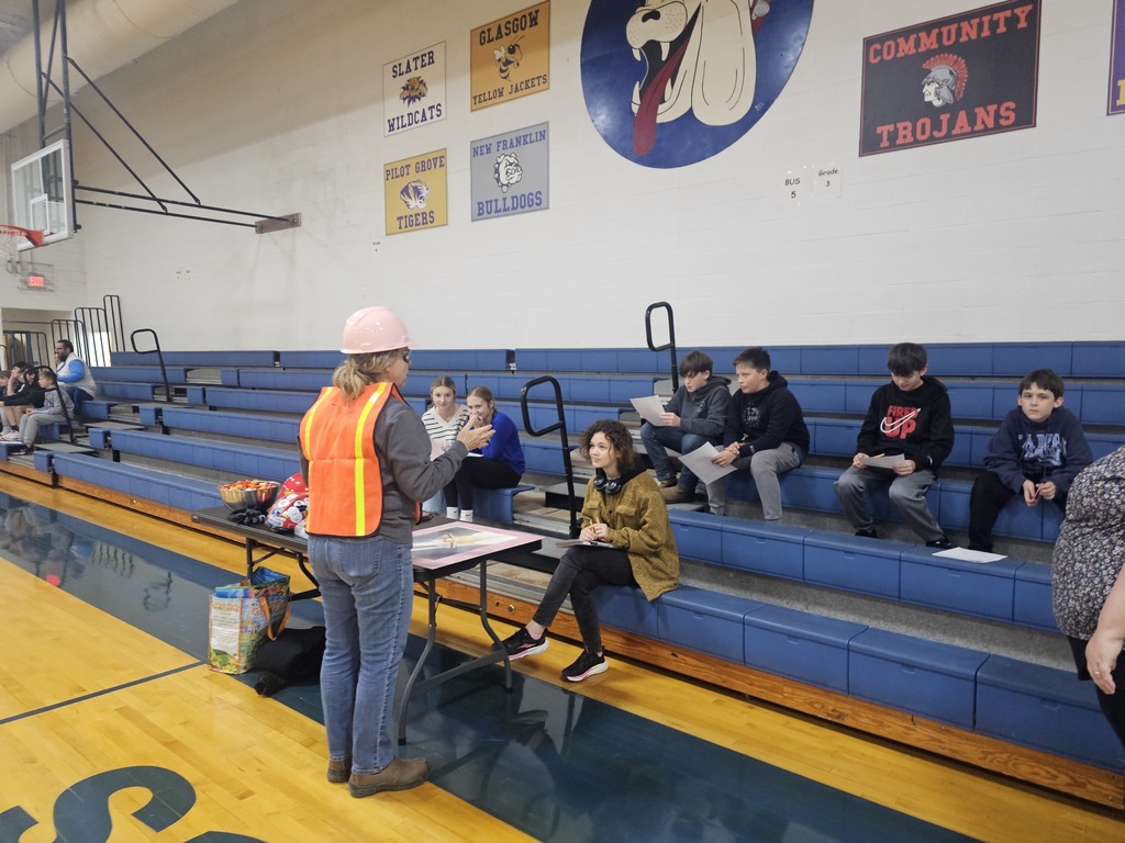 Students listening to a speaker at the career fair.