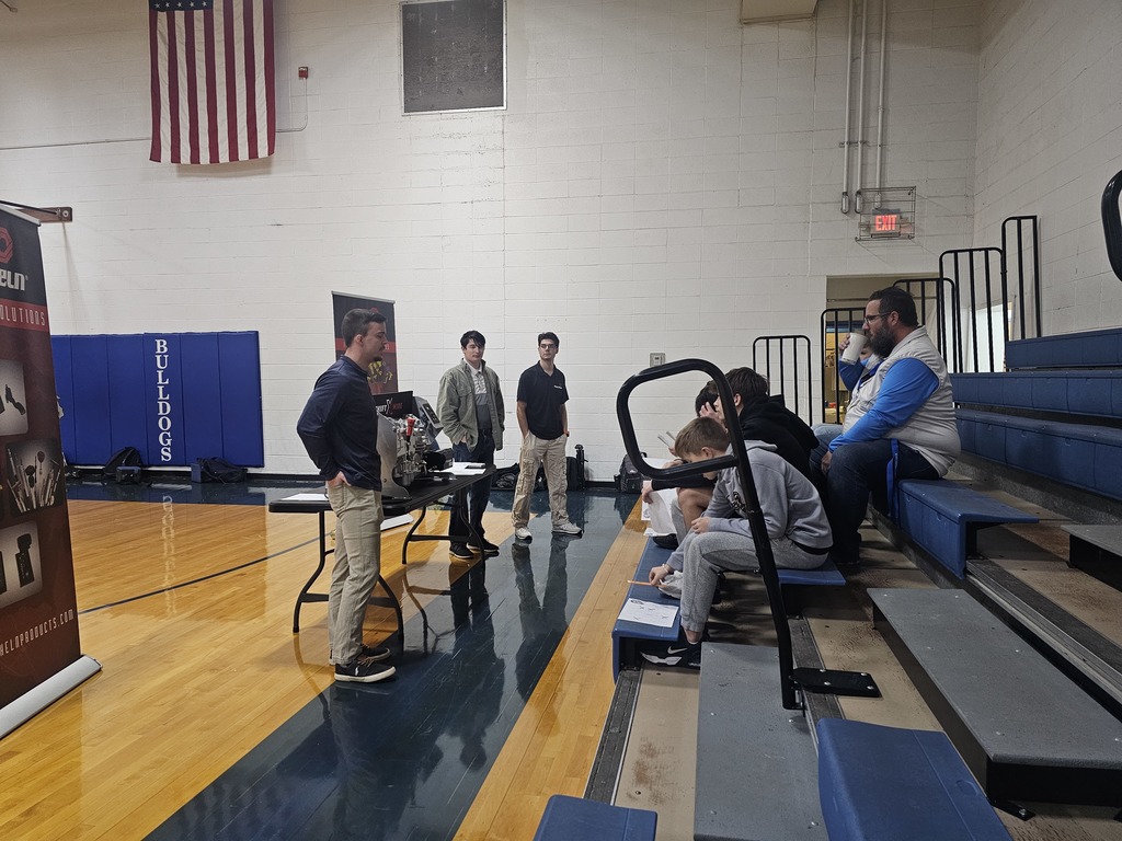 Students listening to a speaker at the career fair.