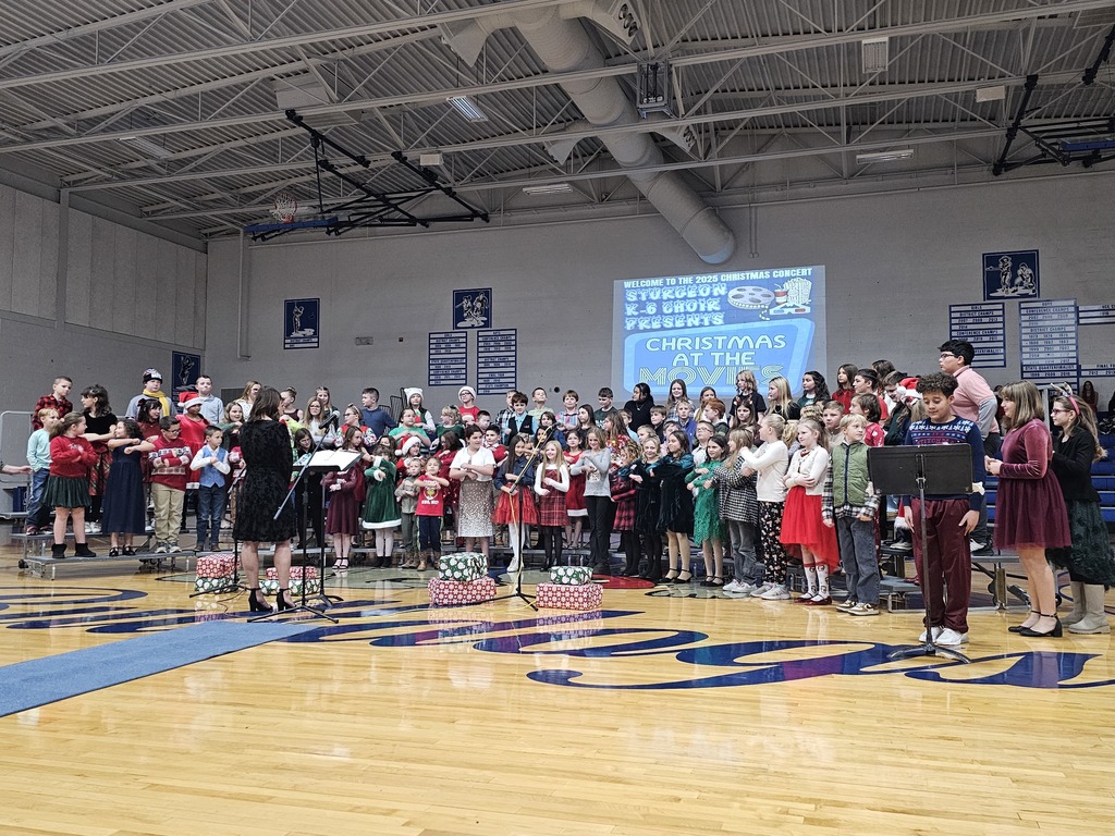 3rd-5th grade classes signing.