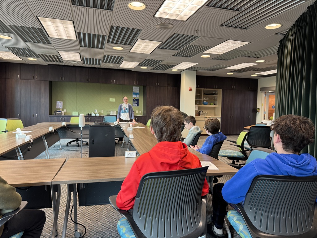 7th grade students listening to a speaker about the exhibit at the Daniel Boone Regional Library.