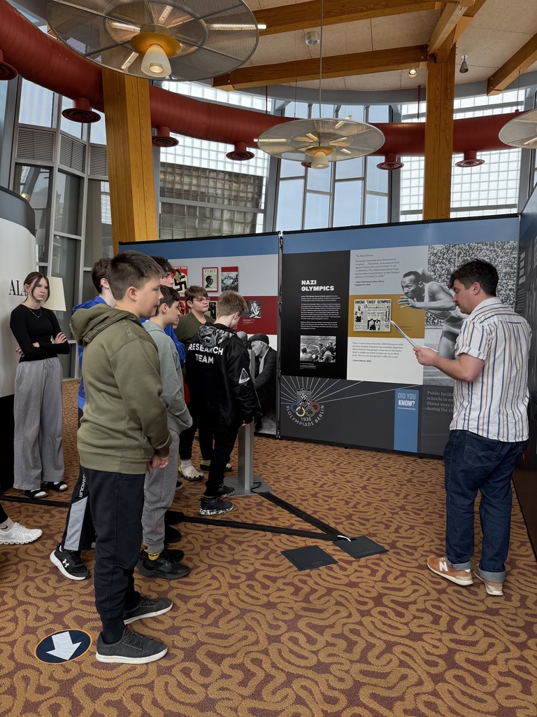 7th grade students listening to a speaker about the exhibit at the Daniel Boone Regional Library.
