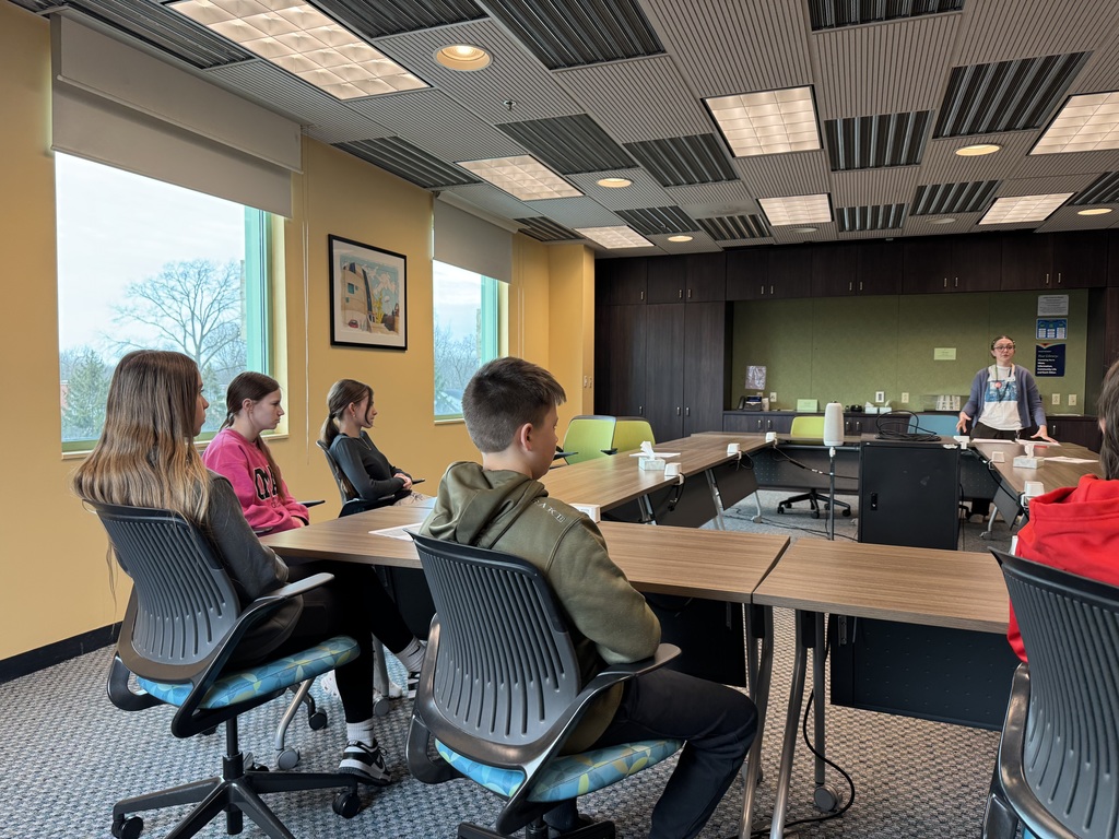 7th grade students listening to a speaker about the exhibit at the Daniel Boone Regional Library.