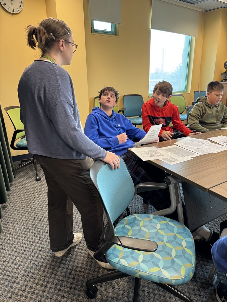7th grade students listening to a speaker about the exhibit at the Daniel Boone Regional Library.