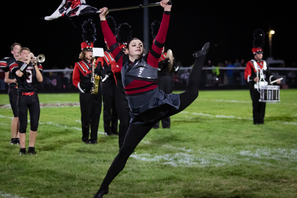 Guard member Synthea Doss leaps during a solo feature.
