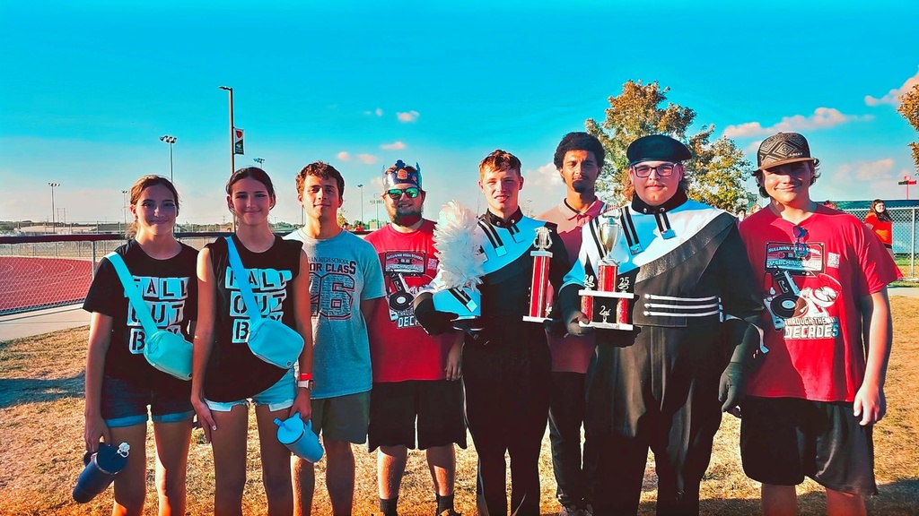 Senior Band members pose with trophies from the Effingham Marching Band Invitational.