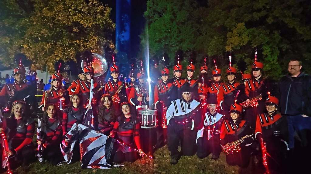 Members of the Sullivan High School Marching Band pose just before the start of the Oblong Spooktacular Parade. The Band won 1st Place as well as 2 caption awards.