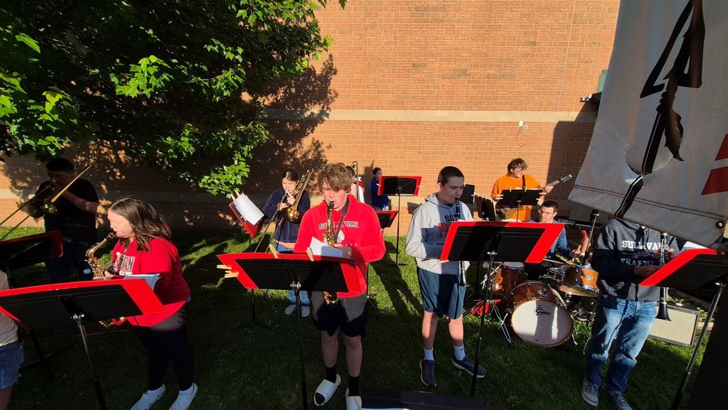 Members of the Sullivan Jazz Band greet Sullivan Elementary students this morning with a performance as they enter the building.