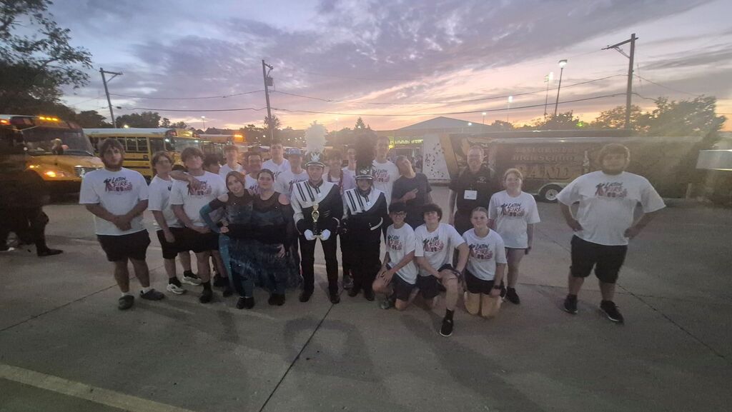 Members of the band pose with their award from the Normal Marching Band Competition