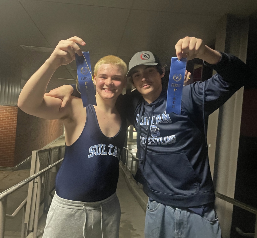 wrestlers holding first place ribbons