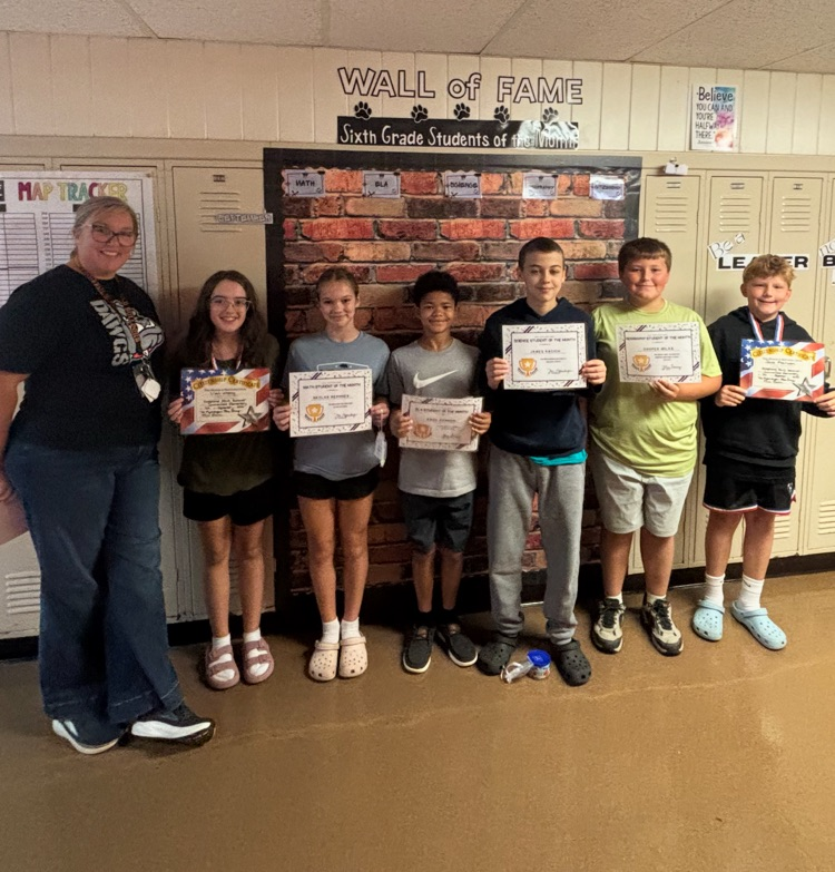 Our 6th grade students of the month with Mrs. Baur