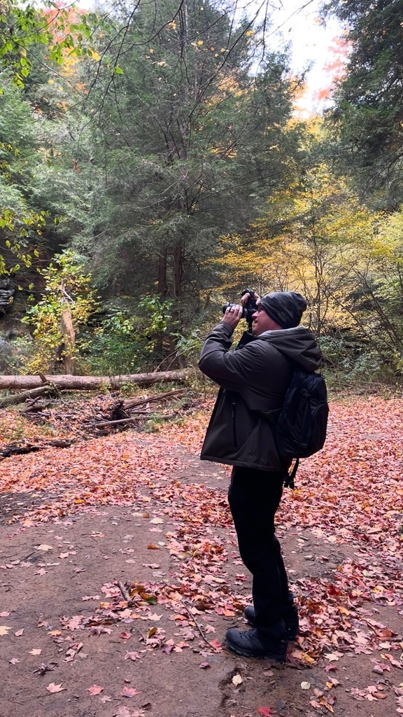 Image of Mr. Westrick taking nature photographs.