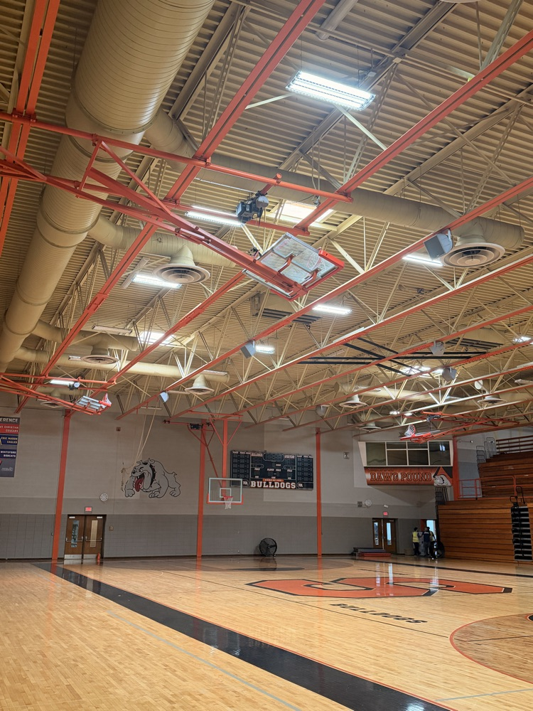 Picture of the high school gym with old lighting