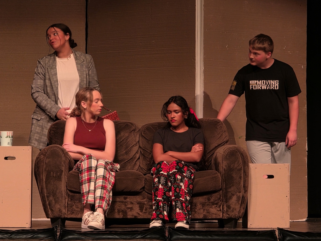 The "family" gathers for an important conversation about their Elf