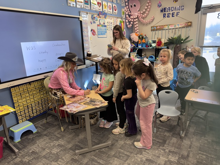  Autographing pictures!