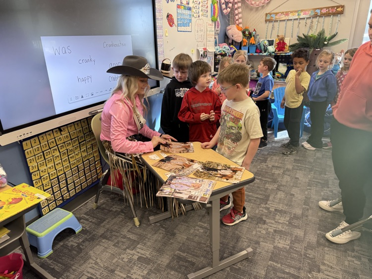  Autographing pictures!