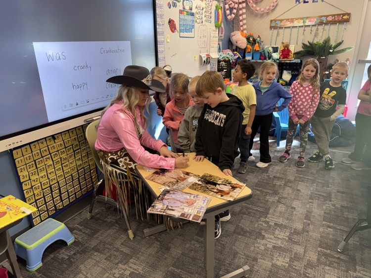  Autographing pictures!