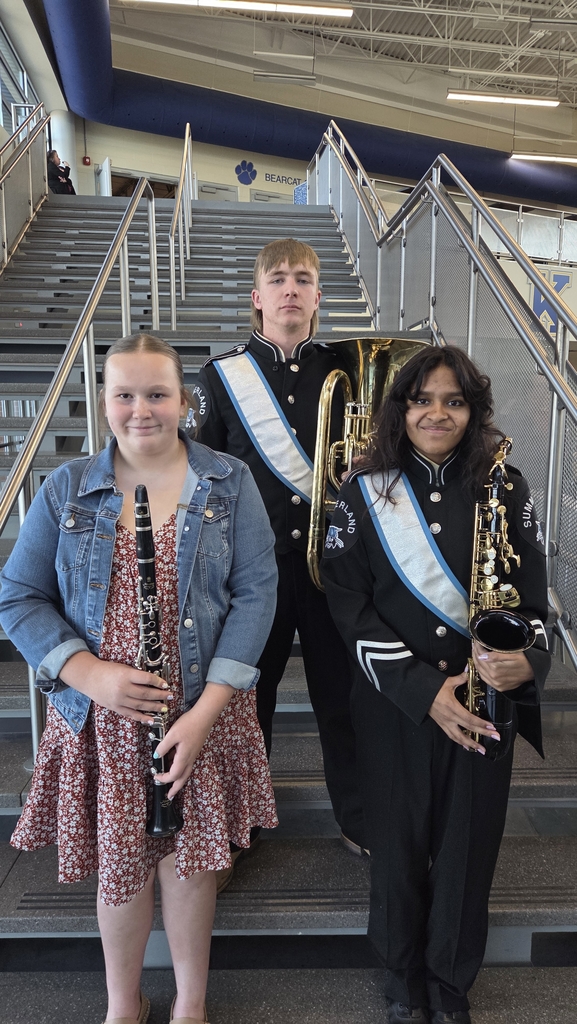 Jack, Jennie and Ella standing on a staircase 