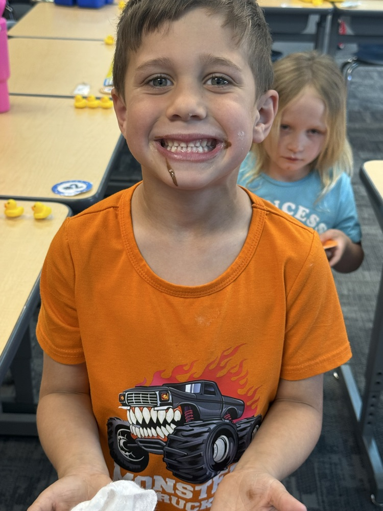 student eating a s’more